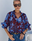 AMONG THE BRAVE EXPEDITION BLUE FLORAL SHIRRED NECK SHORT SLEEVE TOP