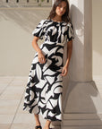 STORIES BE TOLD STAGE CUTOUT PRINT PUFF SLEEVE FLOATY MAXI DRESS