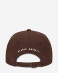 STATUS ANXIETY UNDER THE SUN CAP