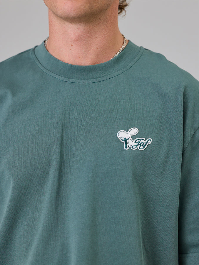 JUST ANOTHER FISHERMAN CASTING HEAVY SHORE TEE DUSK PINE