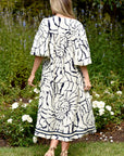 CURATE STYLE IN EXCESS DRESS