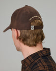 JUST ANOTHER FISHERMAN STAMP TILLER WAX CAP BROWN