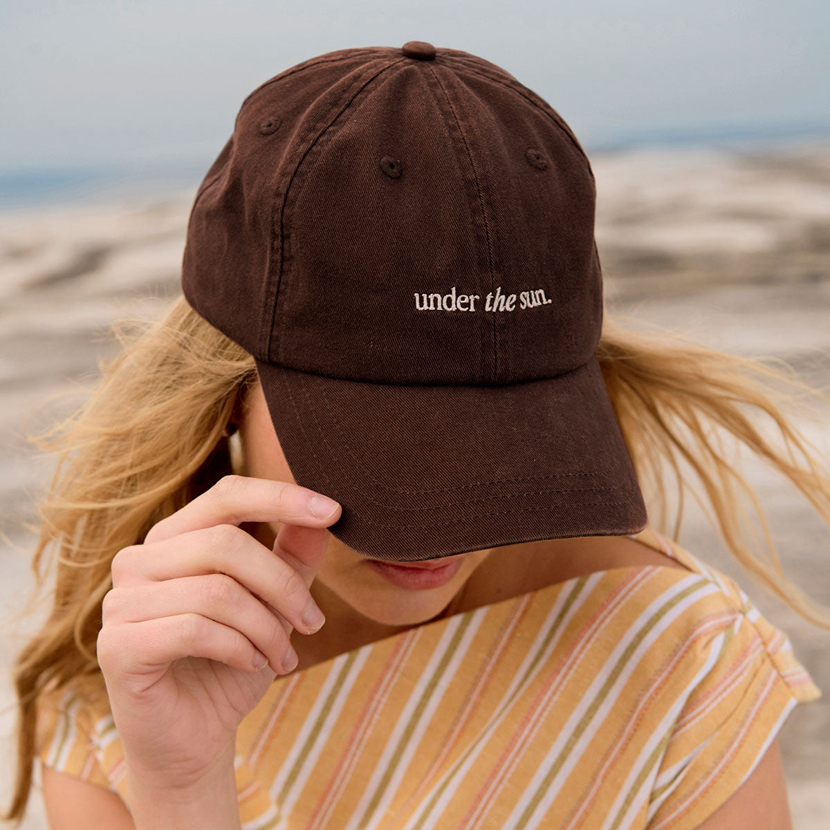 STATUS ANXIETY UNDER THE SUN CAP